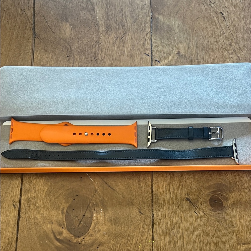 Hermes Gourmette Double Tour (GUC) and Sports orange (new) Apple Watch bands.